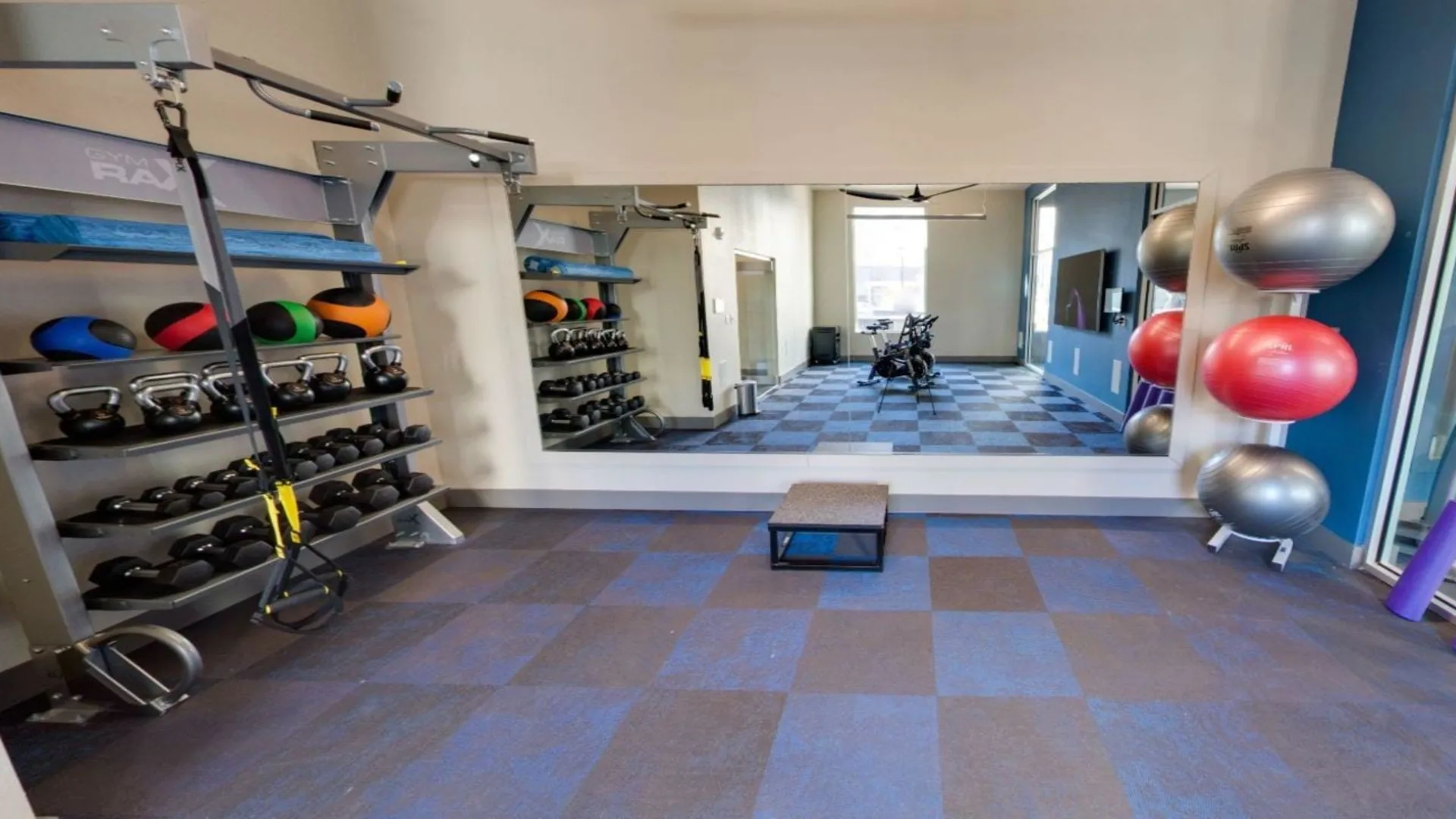 a gym room with a variety of equipment at The Argon