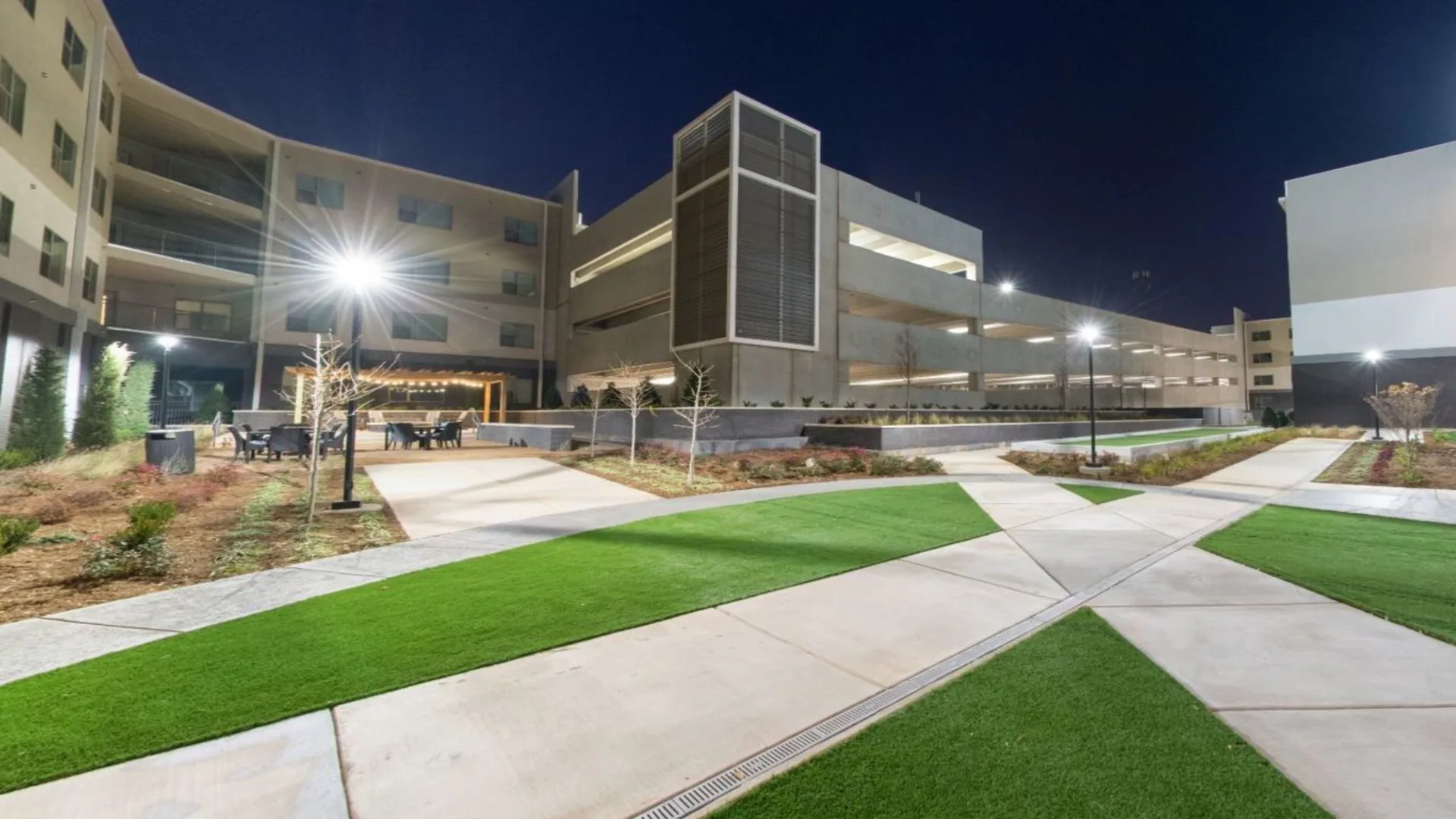 a night view of a hospital building with artificial grass at The Argon