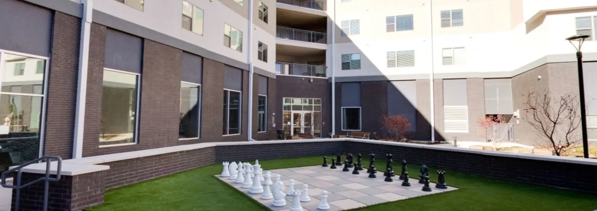 chess board in front of a building with a courtyard at The Argon
